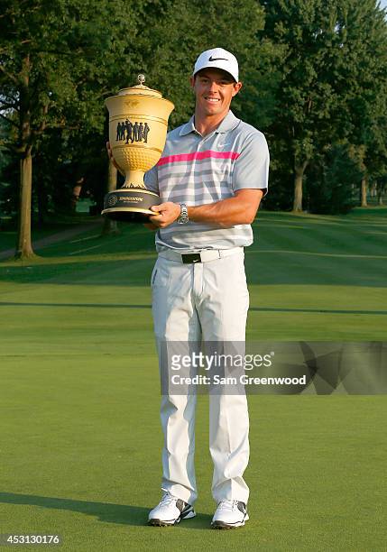 Rory McIlroy of Northern Ireland holds the Gary Player Cup trophy after winning the World Golf Championships-Bridgestone Invitational with a score of...