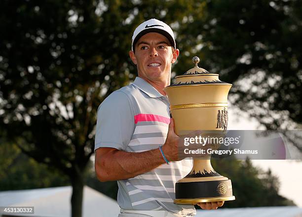 Rory McIlroy of Northern Ireland holds the Gary Player Cup trophy after winning the World Golf Championships-Bridgestone Invitational with a score of...