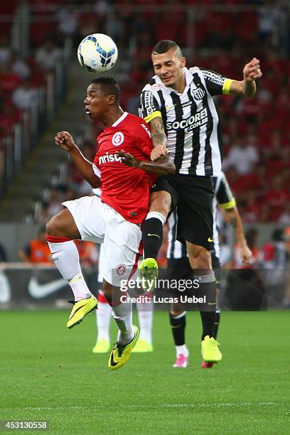 Welligton of Internacional battles for the ball against Alisson of Santos during match between Internacional and Santos as part of Brasileirao Series...