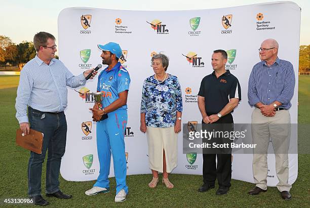 Robin Uthappa, captain of India 'A' receives the trophy after winning the match during the Cricket Australia Quadrangular Series Final match between...