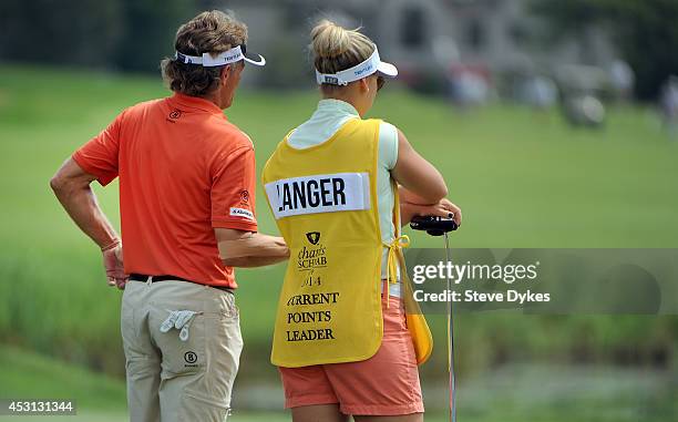 Bernhard Langer of Germany stands next to his daughter and caddie Christina Langer as they wait on the sixth hole during the final round of the 3M...