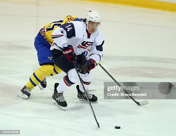 Sonny Milano of USA White skates against Team Sweden during the 2014 USA Hockey Junior Evaluation Camp at the Lake Placid Olympic Center on August 3,...