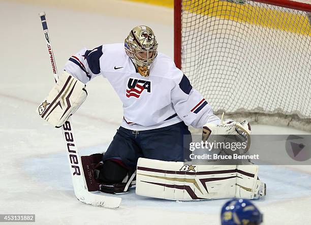 Thatcher Demko of USA White skates against Team Sweden during the 2014 USA Hockey Junior Evaluation Camp at the Lake Placid Olympic Center on August...