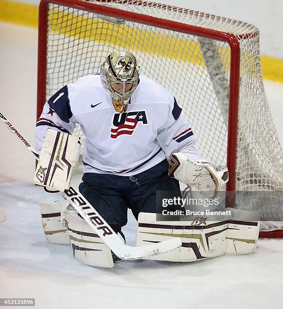 Thatcher Demko of USA White skates against Team Sweden during the 2014 USA Hockey Junior Evaluation Camp at the Lake Placid Olympic Center on August...