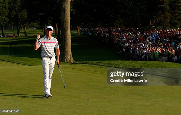 Rory McIlroy of Northern Ireland celebrates on the 18th green after winning the World Golf Championships-Bridgestone Invitational during the final...