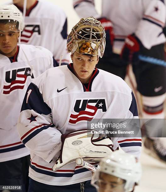 Thatcher Demko of USA White leaves the ice after playing against Team Sweden during the 2014 USA Hockey Junior Evaluation Camp at the Lake Placid...