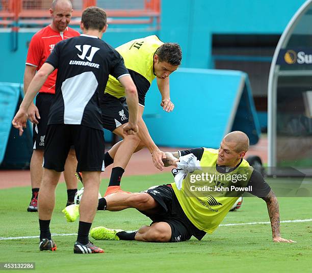 Martin Skrtel and Rickie Lambert of Liverpool in action during an open training session at Sunlife Stadium on August 3, 2014 in Miami, Florida.