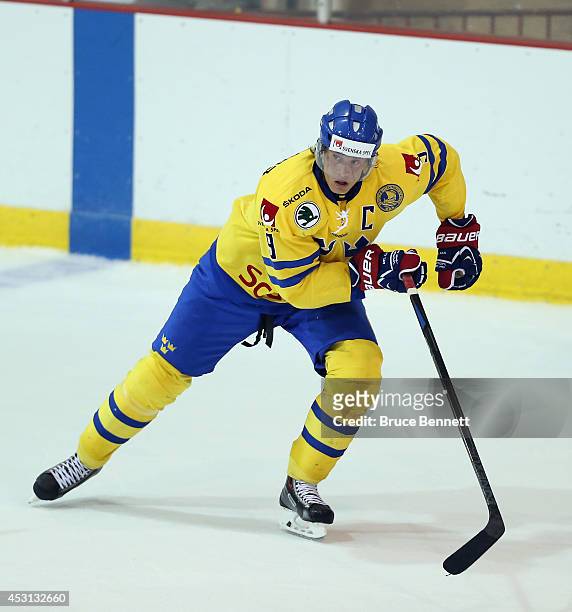 Jacob de la Rose of Team Sweden skates against USA White during the 2014 USA Hockey Junior Evaluation Camp at the Lake Placid Olympic Center on...
