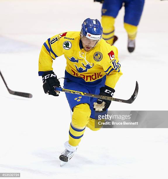 Axel Holmstrom of Team Sweden skates against USA White during the 2014 USA Hockey Junior Evaluation Camp at the Lake Placid Olympic Center on August...