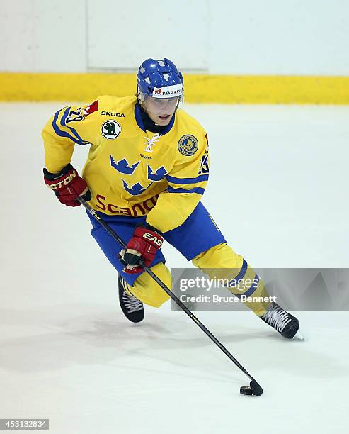 Anton Blidh of Team Sweden skates against USA White during the 2014 USA Hockey Junior Evaluation Camp at the Lake Placid Olympic Center on August 3,...