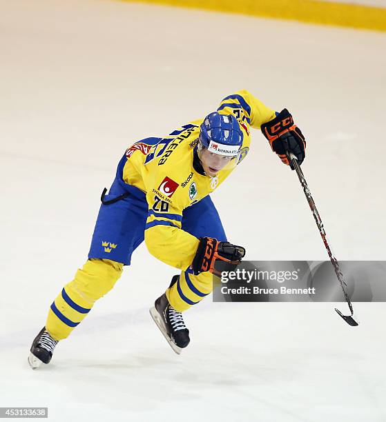 Jakob Forsbaka-Karlsson of Team Sweden skates against USA White during the 2014 USA Hockey Junior Evaluation Camp at the Lake Placid Olympic Center...