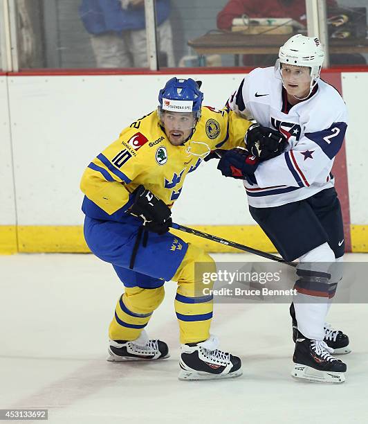 Axel Holmstrom of Team Sweden skates against USA White during the 2014 USA Hockey Junior Evaluation Camp at the Lake Placid Olympic Center on August...