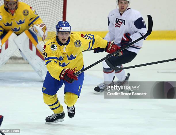 Anton Blidh of Team Sweden skates against USA White during the 2014 USA Hockey Junior Evaluation Camp at the Lake Placid Olympic Center on August 3,...