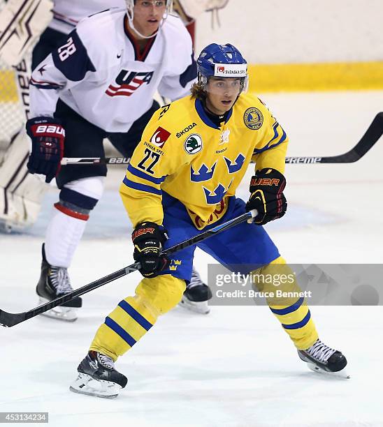 Adam Brodecki of Team Sweden skates against USA White during the 2014 USA Hockey Junior Evaluation Camp at the Lake Placid Olympic Center on August...