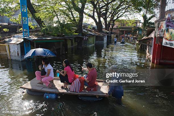 Flooding in a street in the Barangay Landayan neighbourhood, in San Pedro near Laguna Lake, after the typhoon Santi hit on October 31. The biggest...