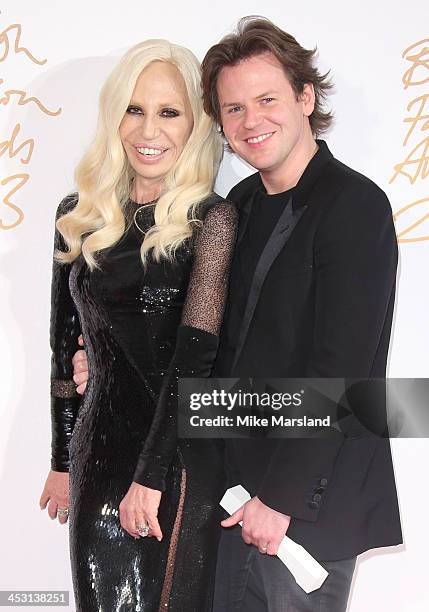 Donatella Versace and Christopher Kane poses in the winners room at the British Fashion Awards 2013 at London Coliseum on December 2, 2013 in London,...
