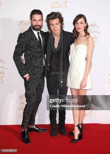 Jack Guinness, Harry Styles and Alexa Chung poses in the winners room at the British Fashion Awards 2013 at London Coliseum on December 2, 2013 in...