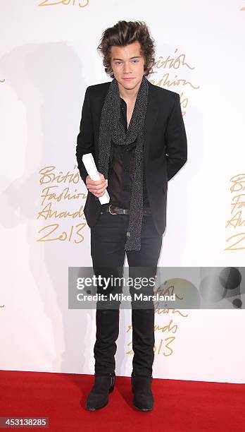 Harry Styles poses in the winners room at the British Fashion Awards 2013 at London Coliseum on December 2, 2013 in London, England.