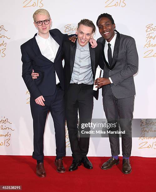 Agape Mdumulla, Jamie Campbell Bower and Sam Cotton poses in the winners room at the British Fashion Awards 2013 at London Coliseum on December 2,...