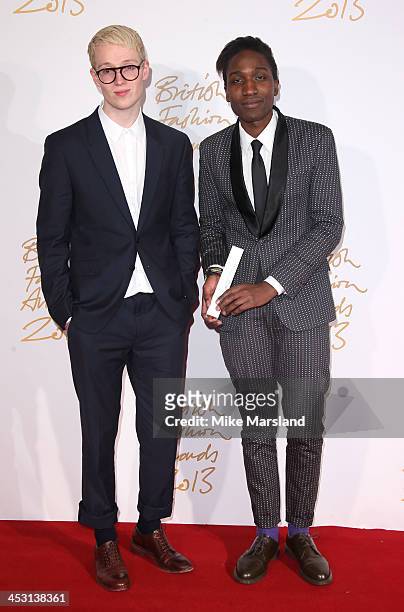 Agape Mdumulla and Sam Cotton poses in the winners room at the British Fashion Awards 2013 at London Coliseum on December 2, 2013 in London, England.