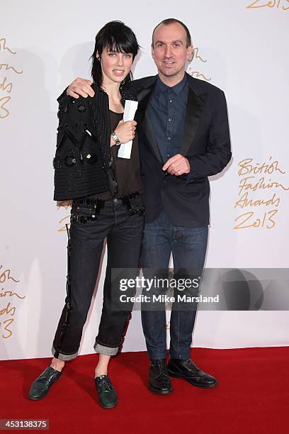 Edie Campbell and Tim Walker poses in the winners room at the British Fashion Awards 2013 at London Coliseum on December 2, 2013 in London, England.