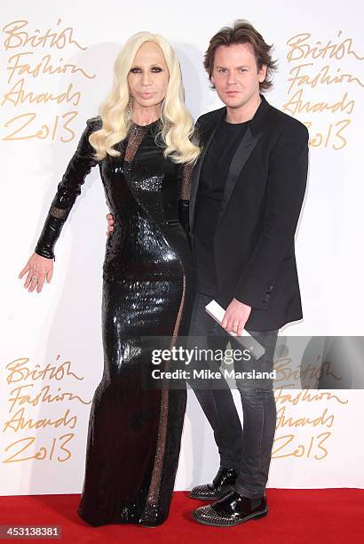 Donatella Versace and Christopher Kane poses in the winners room at the British Fashion Awards 2013 at London Coliseum on December 2, 2013 in London,...