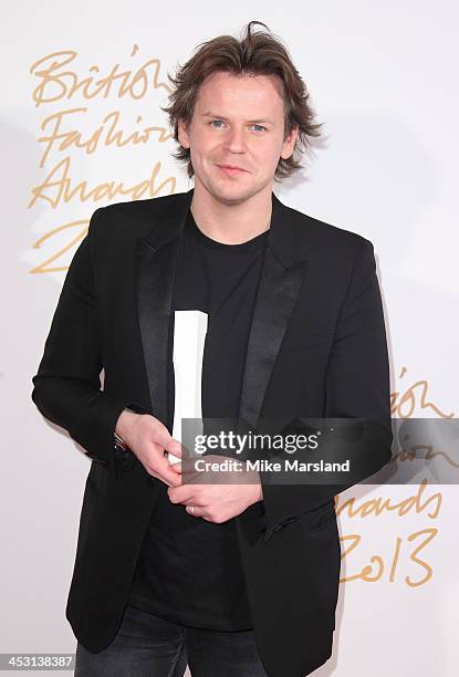 Christopher Kane poses in the winners room at the British Fashion Awards 2013 at London Coliseum on December 2, 2013 in London, England.