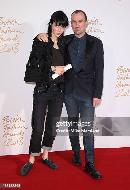 Edie Campbell and Tim Walker poses in the winners room at the British Fashion Awards 2013 at London Coliseum on December 2, 2013 in London, England.