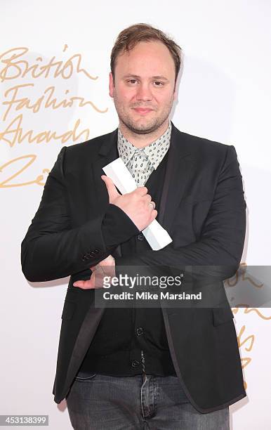 Nicholas Kirkwood poses in the winners room at the British Fashion Awards 2013 at London Coliseum on December 2, 2013 in London, England.
