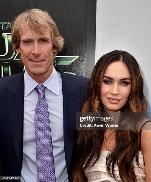 Producer Michael Bay and actress Megan Fox attend the premiere of Paramount Pictures' "Teenage Mutant Ninja Turtles" at Regency Village Theater on...