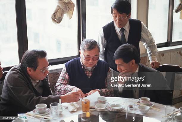 Gordon Wu talks to business partners during as lunch near the construction site for the highway between Hong Kong and Guangzhou in China. Wu is a...