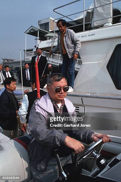 Gordon Wu drives a boat up the Pear River to the construction site for the highway between Hong Kong and Guangzhou in China. Wu is a leading...