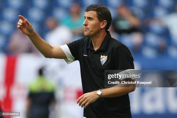 Head coach Javi Gracia of Malaga issues instructions during the match between FC Malaga and West Ham United as part of the Schalke 04 Cup Day at...