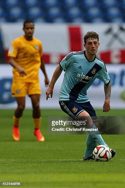 Daniel Whitehead of West Ham United runs with the ball during the match between FC Malaga and West Ham United as part of the Schalke 04 Cup Day at...