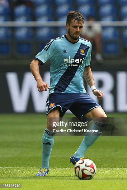 Carl Jenkinson of West Ham United runs with the ball during the match between FC Malaga and West Ham United as part of the Schalke 04 Cup Day at...