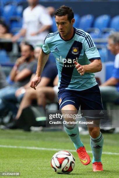 Matt Jarvis of West Ham United runs with the ball during the match between FC Malaga and West Ham United as part of the Schalke 04 Cup Day at...