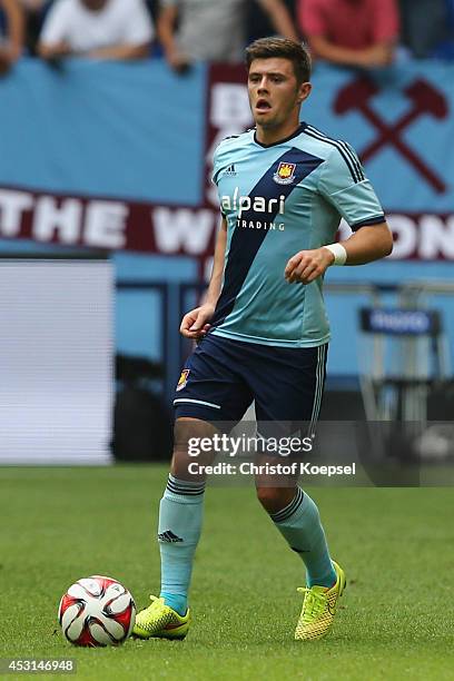 Aaron Creswell of West Ham United runs with the ball during the match between FC Malaga and West Ham United as part of the Schalke 04 Cup Day at...