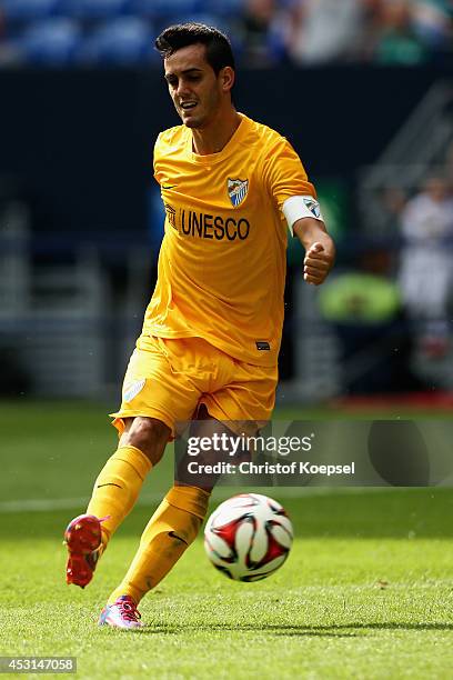 Juanmi of Malaga runs with the ball during the match between FC Malaga and West Ham United as part of the Schalke 04 Cup Day at Veltins-Arena on...