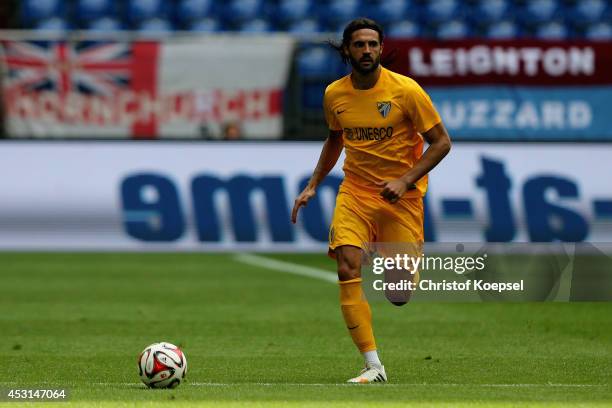 Sergio Sanchez of Malaga runs with the ball during the match between FC Malaga and West Ham United as part of the Schalke 04 Cup Day at Veltins-Arena...