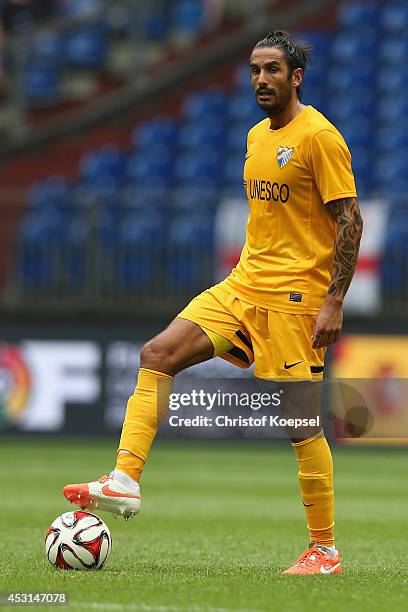 Alberto Angeleri of Malaga runs with the ball during the match between FC Malaga and West Ham United as part of the Schalke 04 Cup Day at...