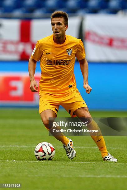 Camacho of Malaga runs with the ball during the match between FC Malaga and West Ham United as part of the Schalke 04 Cup Day at Veltins-Arena on...