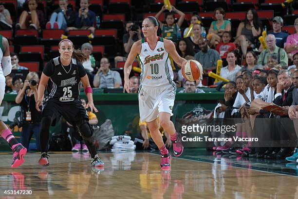 Sue Bird of the Seattle Storm handles the ball against Becky Hammon of the San Antonio Silver Stars during the game on August 3, 2014 at Key Arena in...