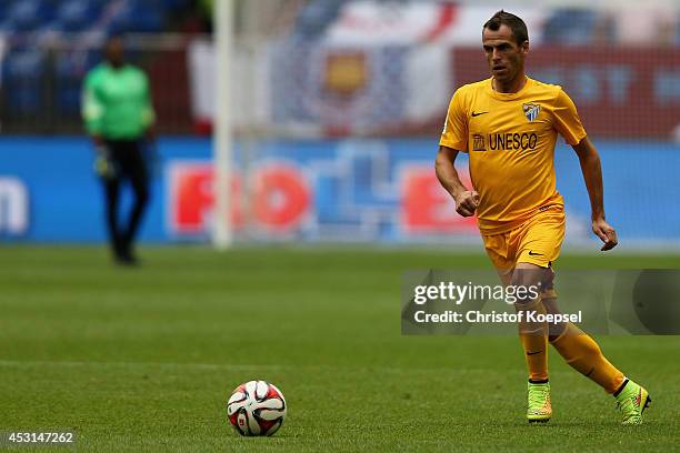 Duda of Malaga runs with the ball during the match between FC Malaga and West Ham United as part of the Schalke 04 Cup Day at Veltins-Arena on August...