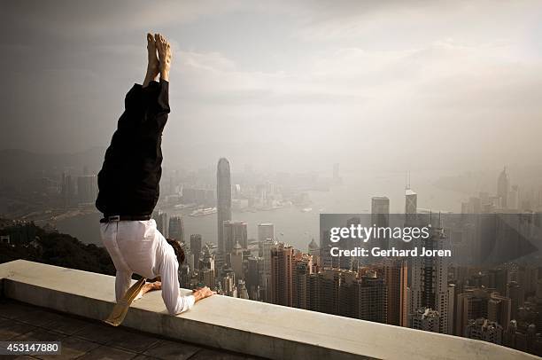 Handstand yoga pose on the rooftop. MODEL RELEASED.