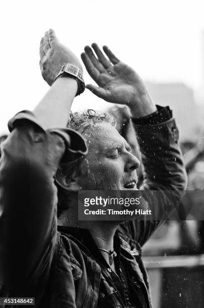 Glen Hansard braves the rain with fans at Lollapalooza 2014 at Grant Park on August 3, 2014 in Chicago, Illinois.