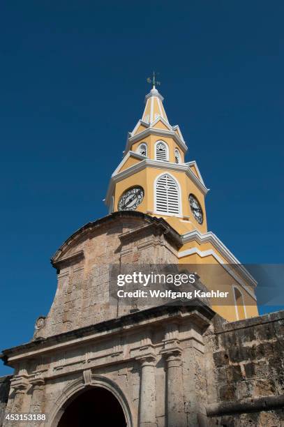 Clock tower on the city gate at Plaza de los Coches, in Cartagena, Colombia, a walled city and Unesco World Heritage Site.