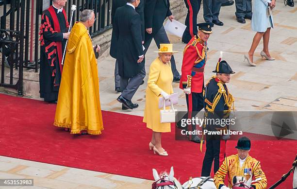 Queen Elizabeth II and Prince Philip leave Westminster Abbey following the Royal Wedding service of Prince William and Princess Kate to ride in a...