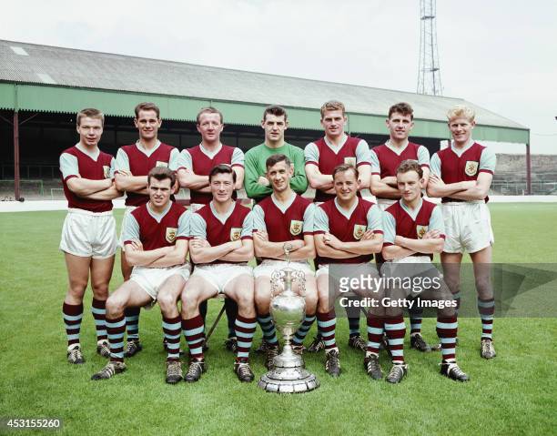 The Burnley Division One championship winning squad of season 1959-60 pose with the trophy at Turf Moor, Burnley, England, selected players include...