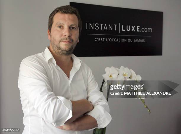 Instant Luxe CEO Yann Le Floc'h poses on July 30, 2014 in Paris. Instant Luxe buys and sells authenticated pre-owned luxury goods. AFP PHOTO /...