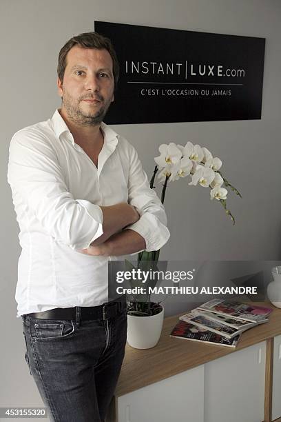 Instant Luxe CEO Yann Le Floc'h poses on July 30, 2014 in Paris. Instant Luxe buys and sells authenticated pre-owned luxury goods. AFP PHOTO /...